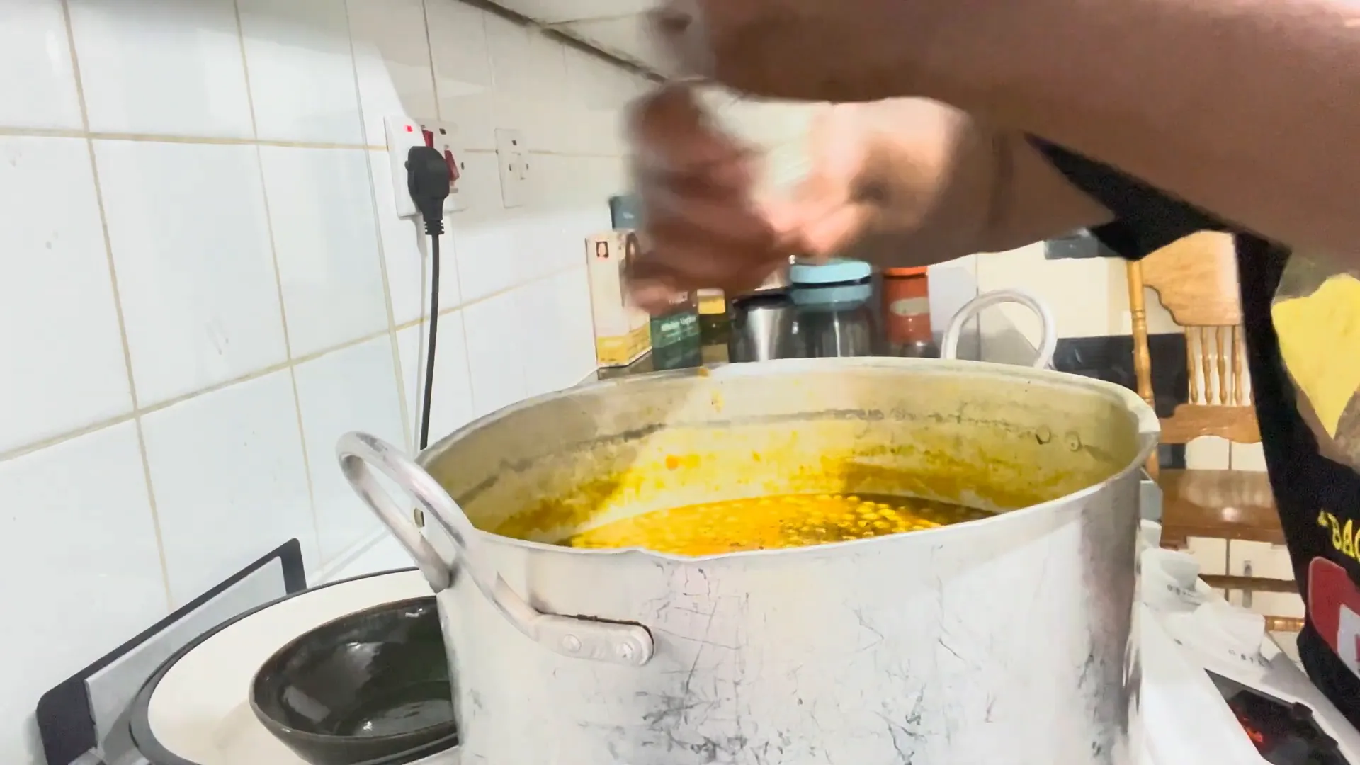 Adding thyme and peas to the soup