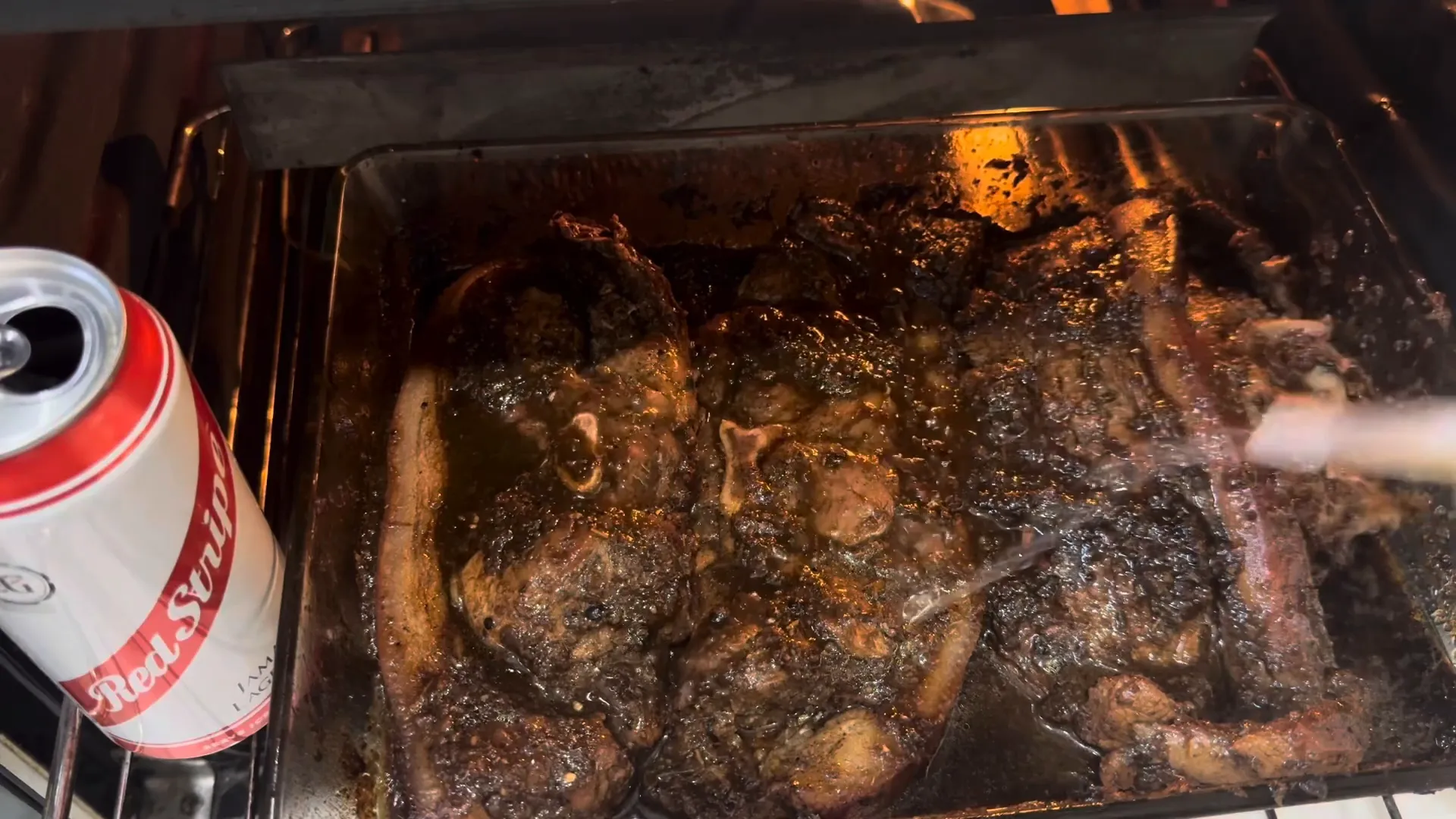 Adding beer to the cooking pork