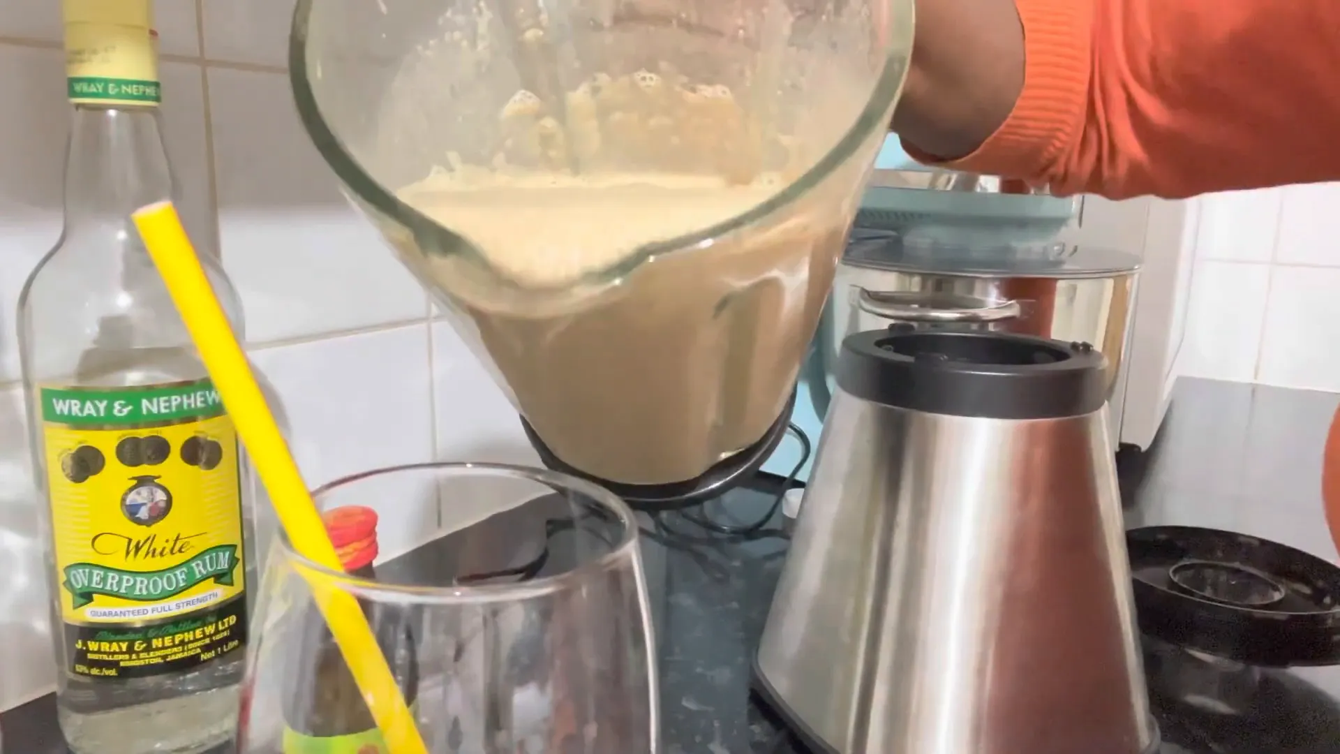 Pouring the strong back drink into a glass