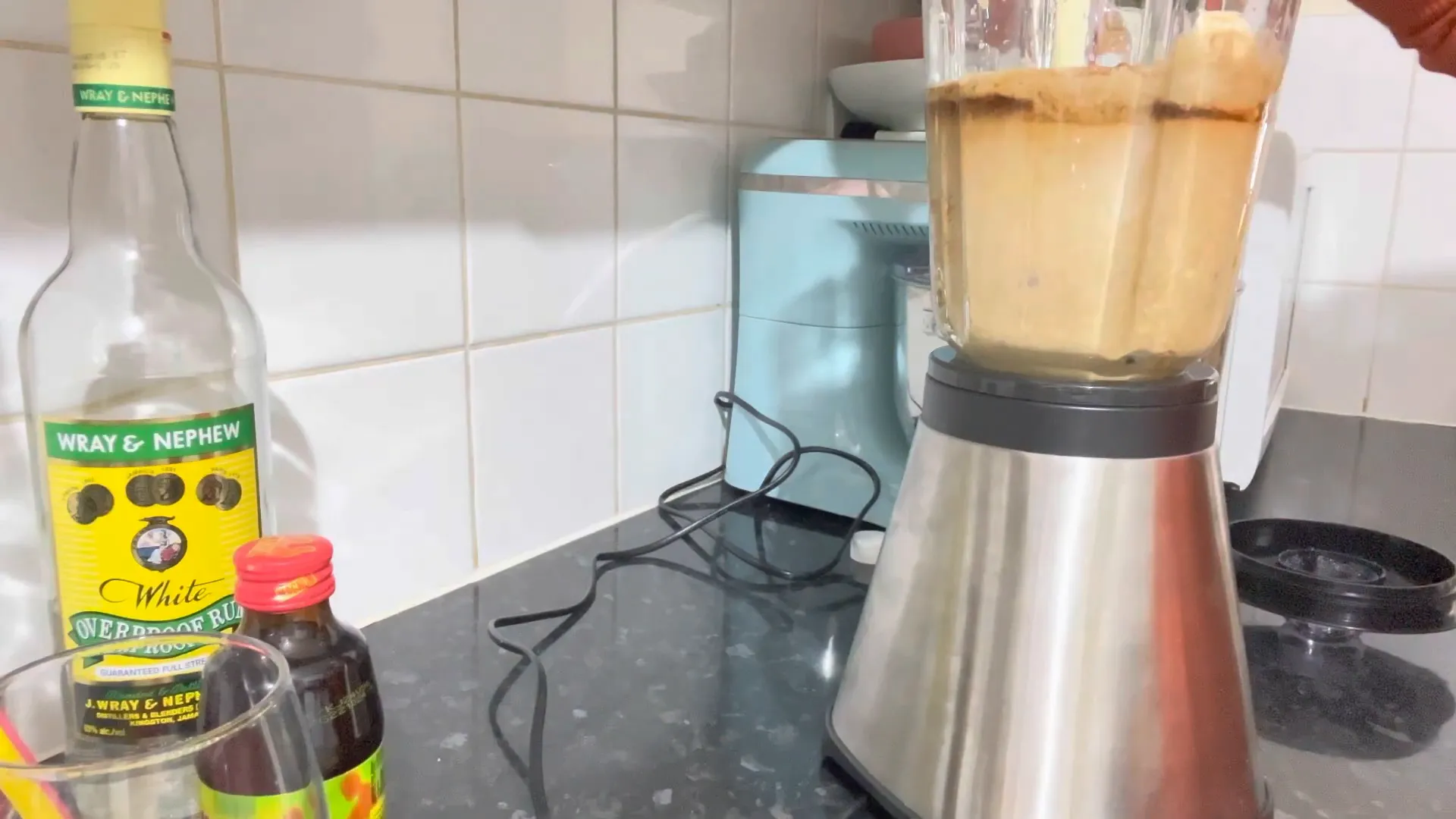 Blending the ingredients for the strong back drink
