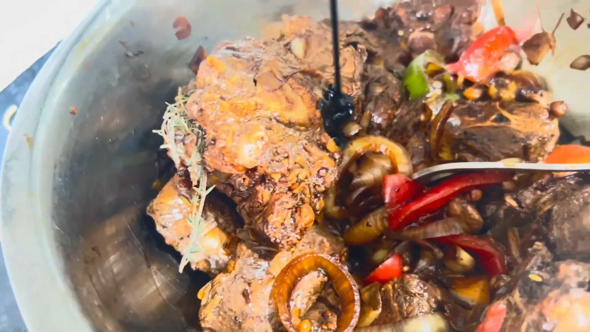 Seasoning the oxtail with browning sauce