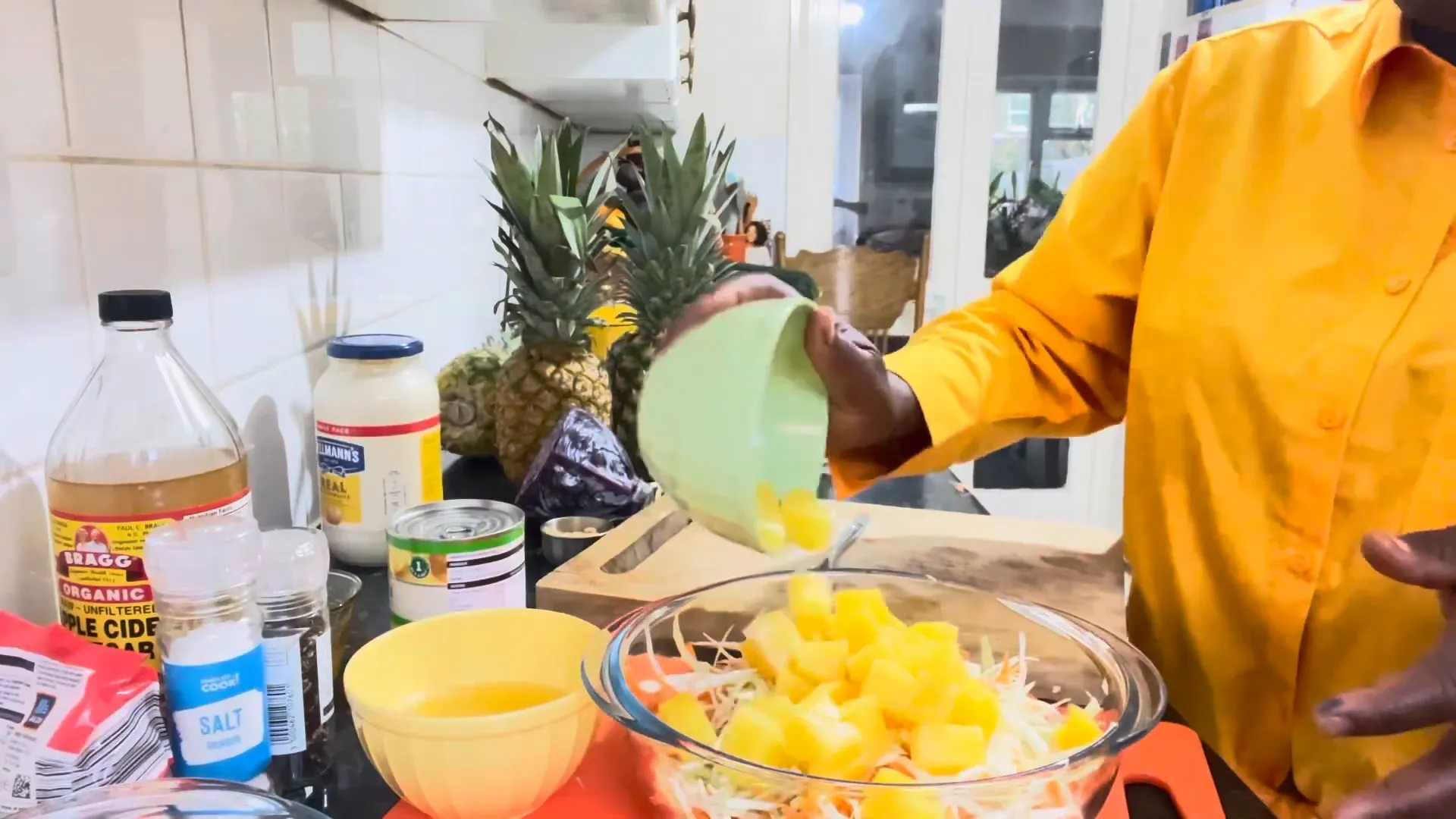 Adding pineapple to the vegetables