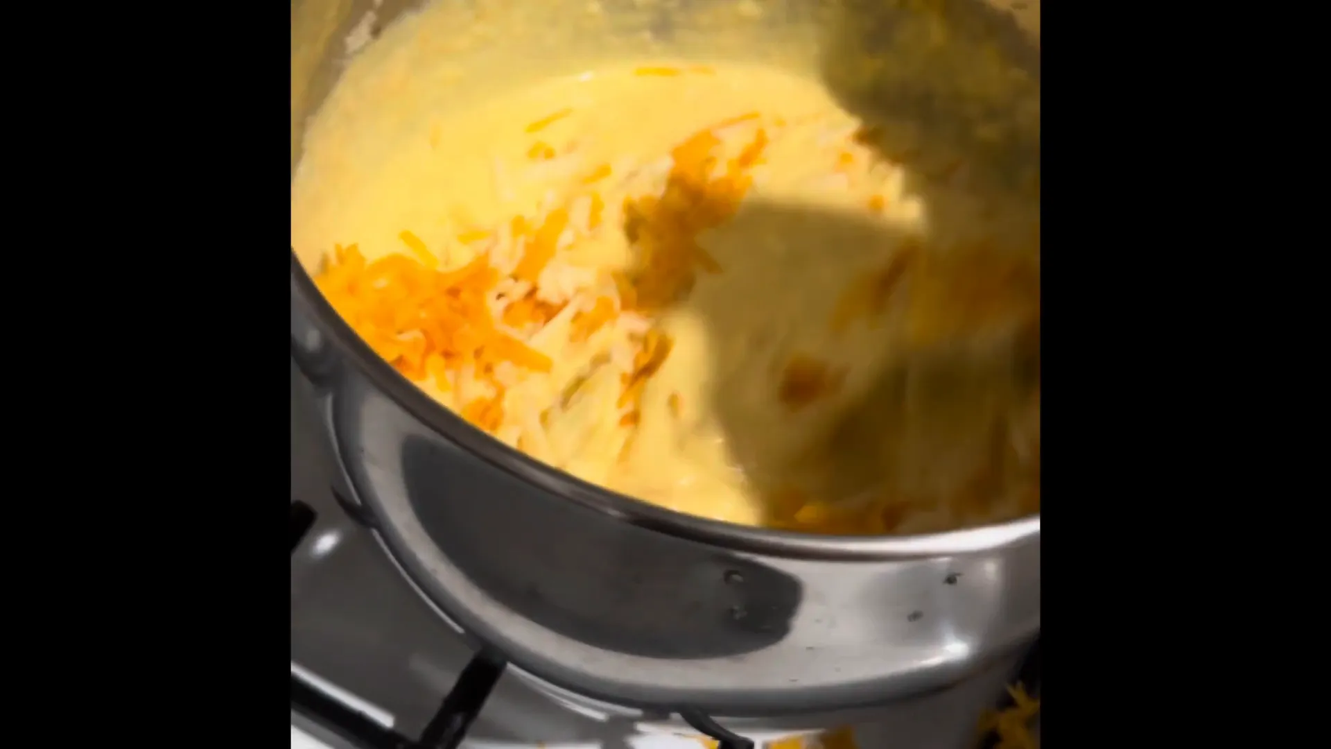 Mixing cheese into the sauce