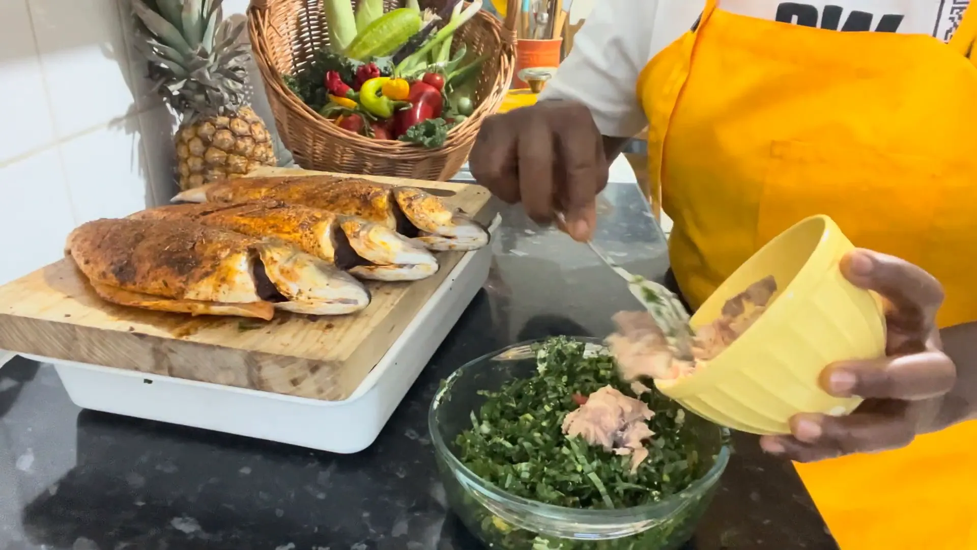 Stuffing the fish with salmon and callaloo