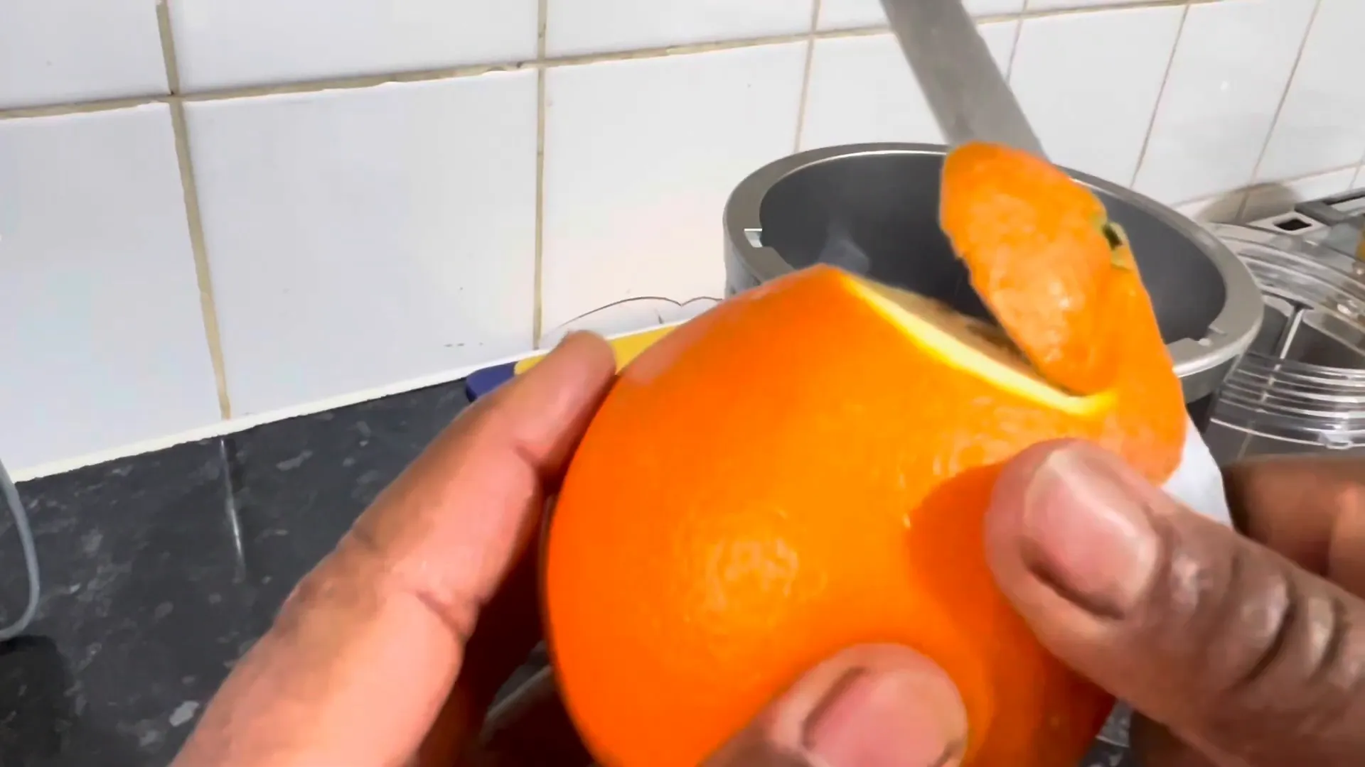 Preparing the orange for the smoothie