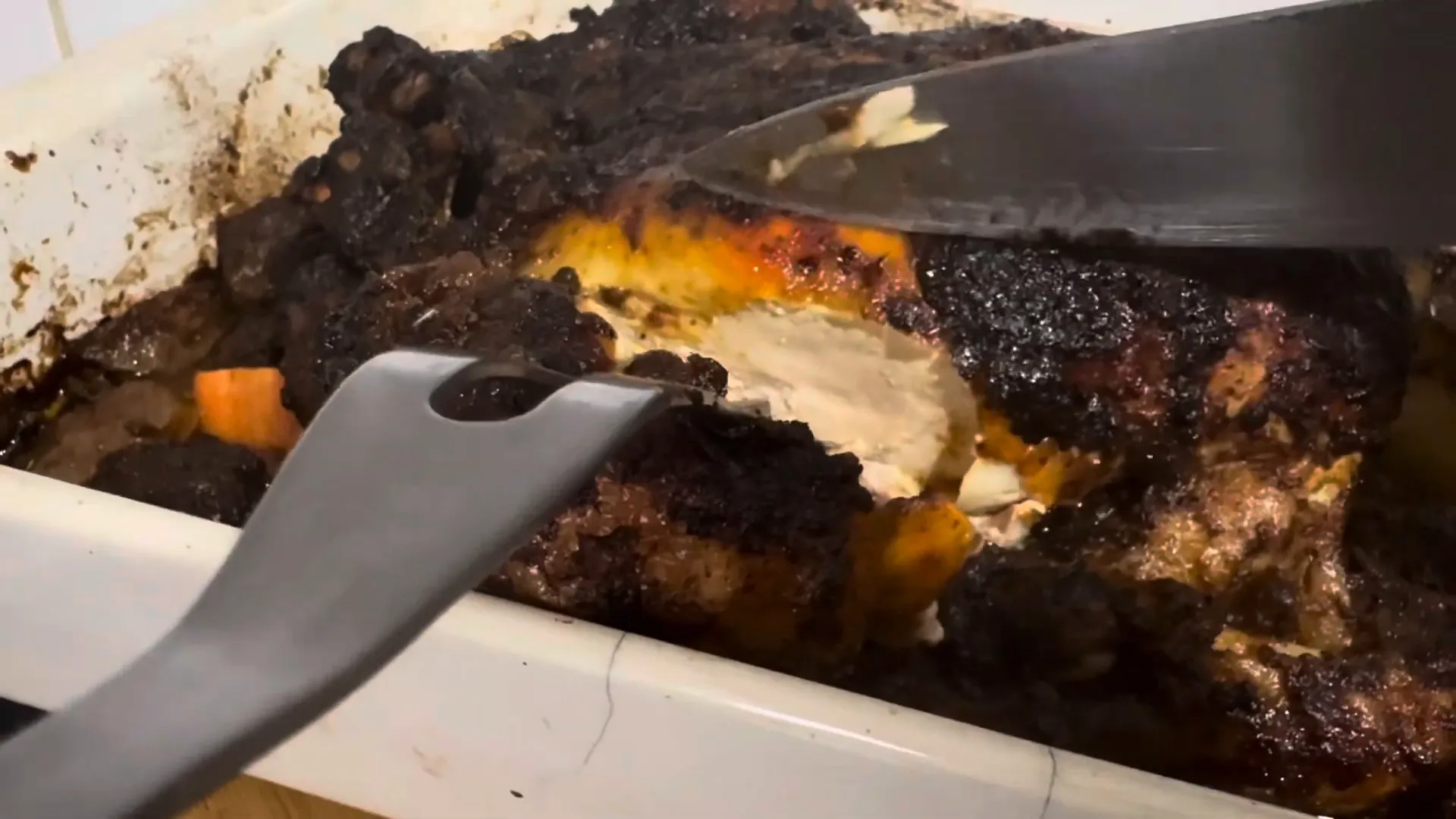 Slicing into the succulent roasted chicken