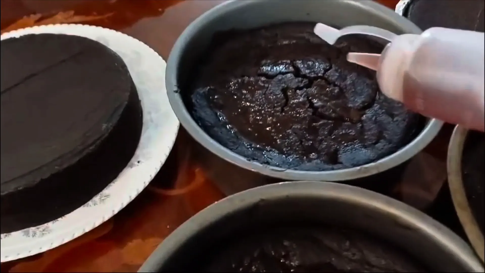 Sealing the cakes with rum and wine