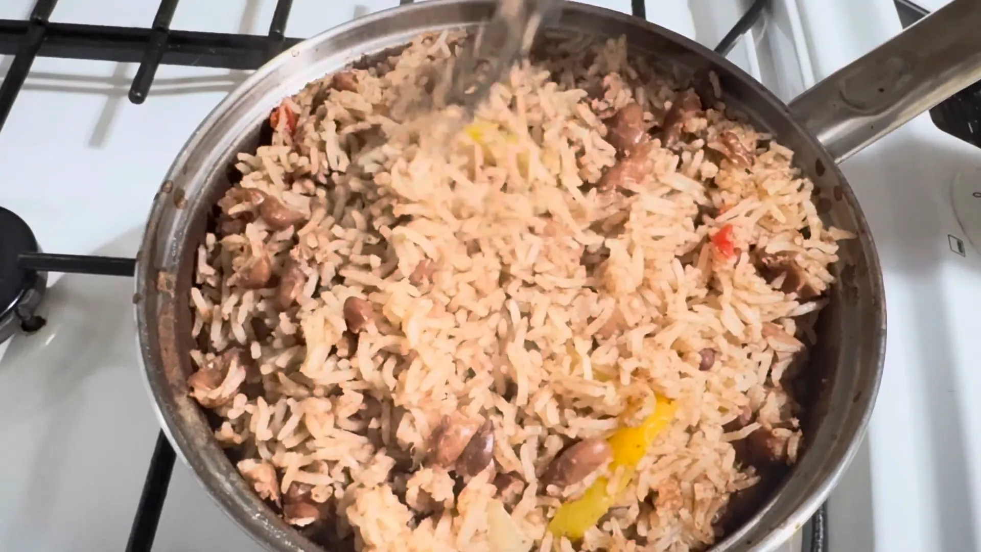 Serving rice and peas with chicken and butter beans