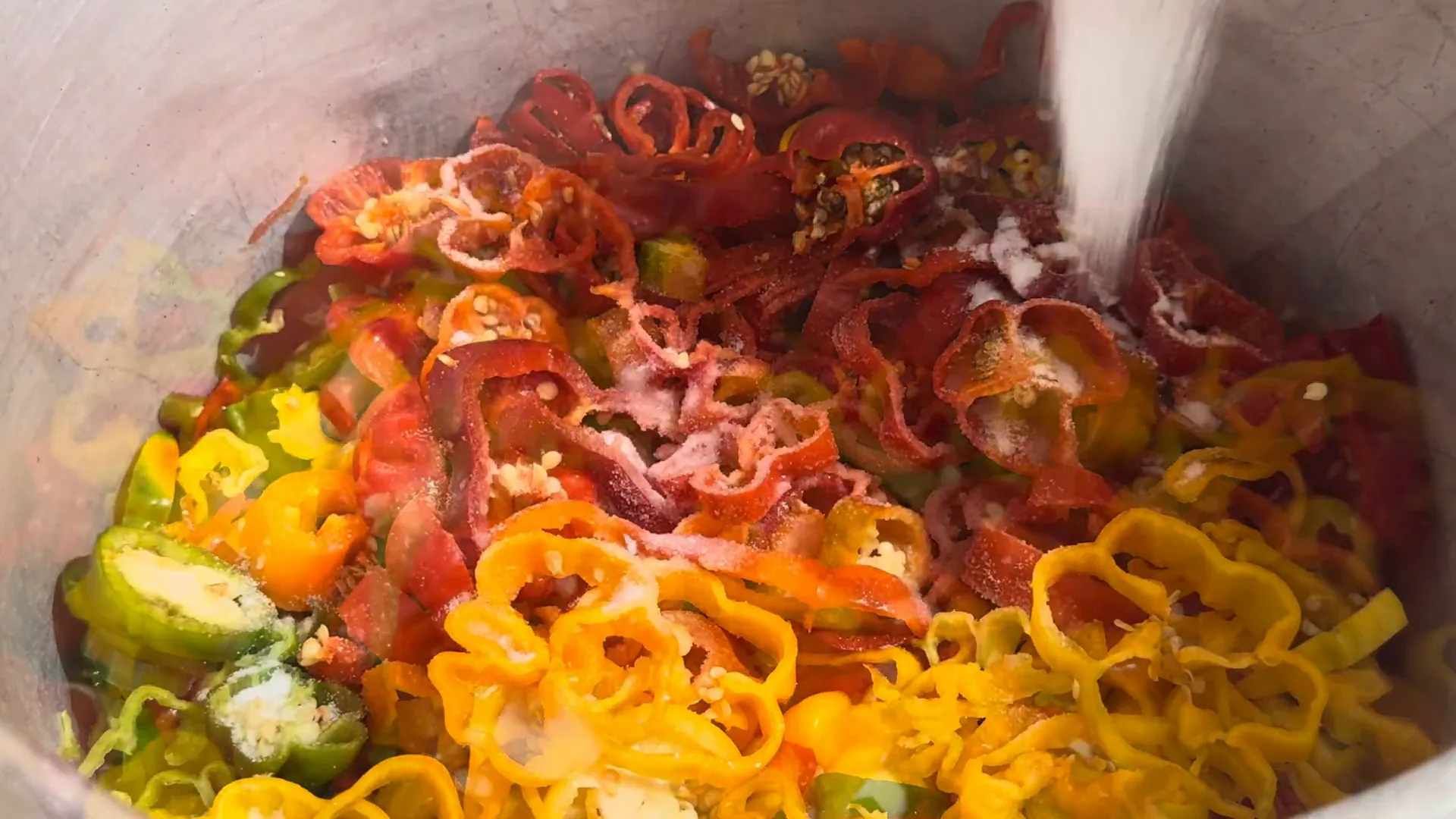 Cooking the peppers with salt and vinegar