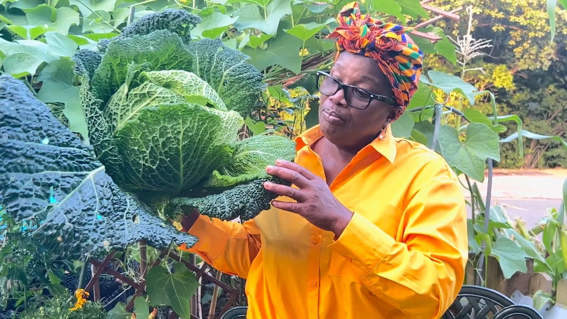 Donna holding a large Savoy cabbage