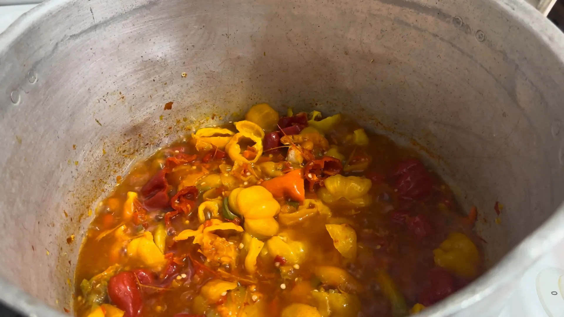 Peppers simmering in the pot