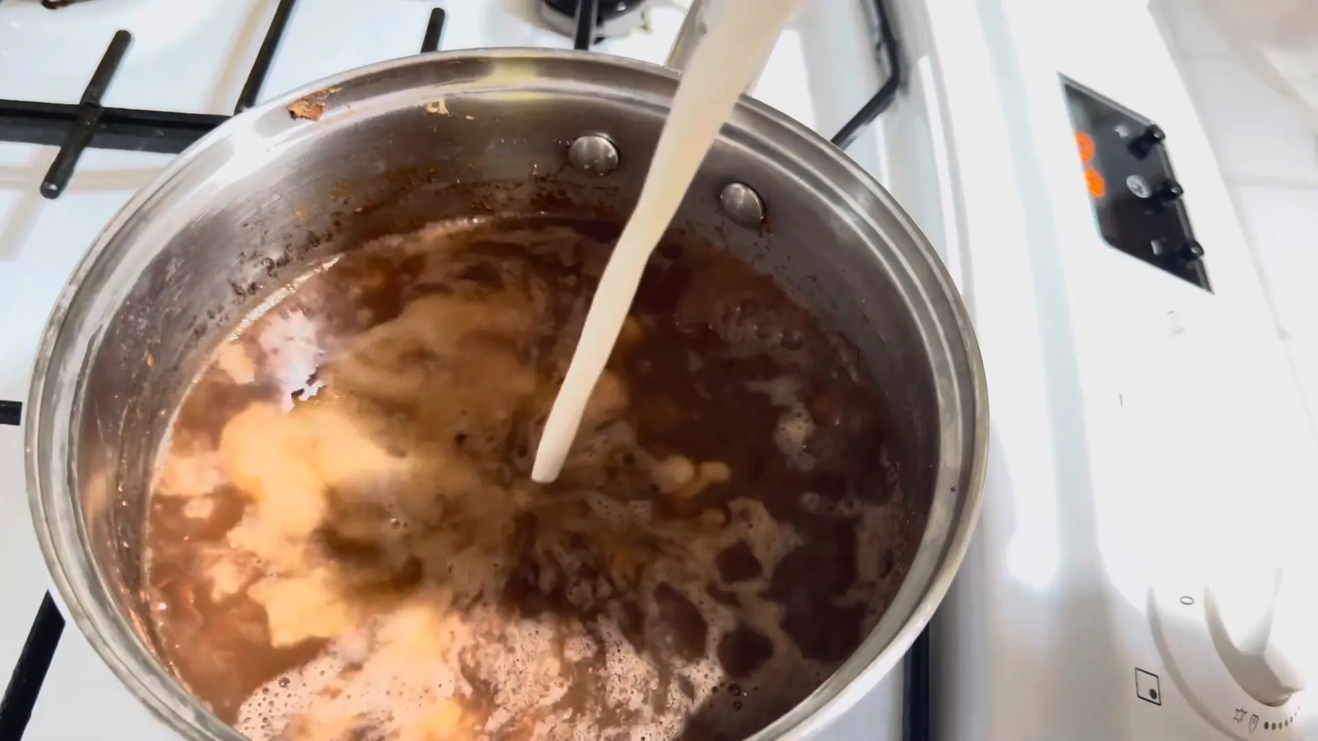 Adding coconut milk to peas