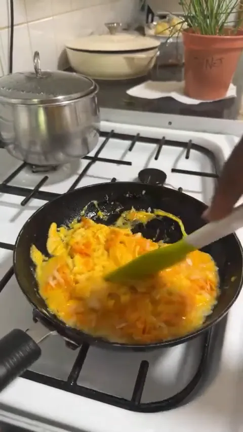 Creamy scrambled eggs with melted cheese and chives